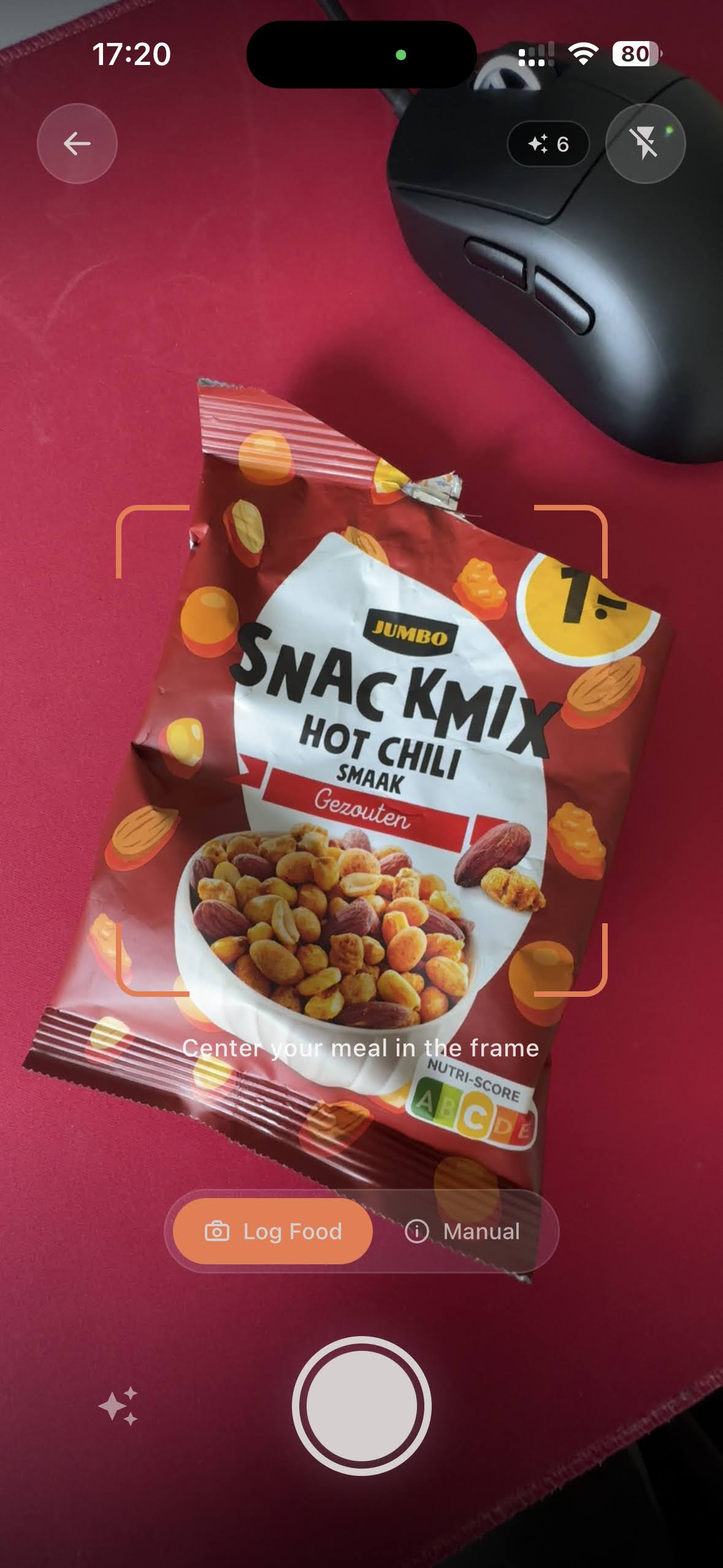Camera viewfinder framing a snack mix bag with the Log Food button